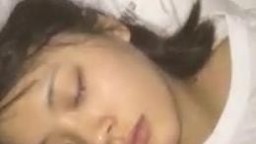 Pretty Asian girl recieves a mouth full while sleeping